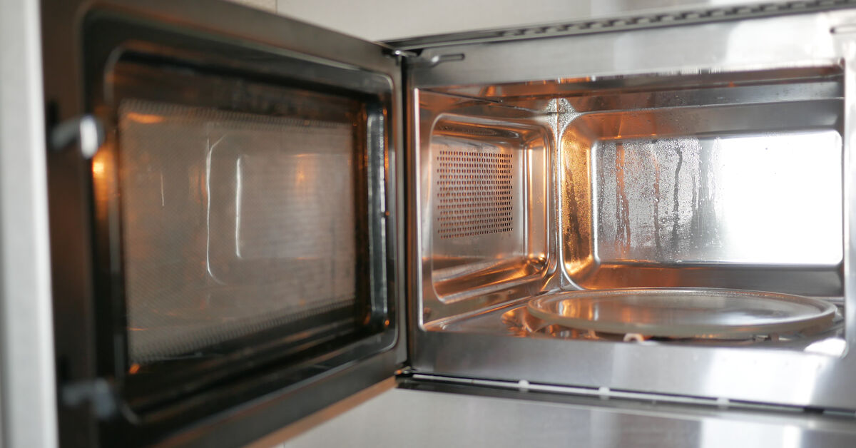 Microwave door with visible grease stains