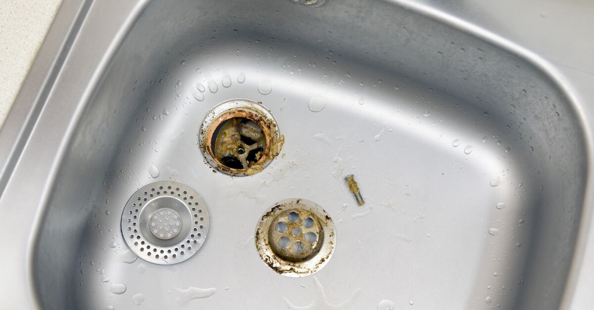 Dirty drain with buildup and grime