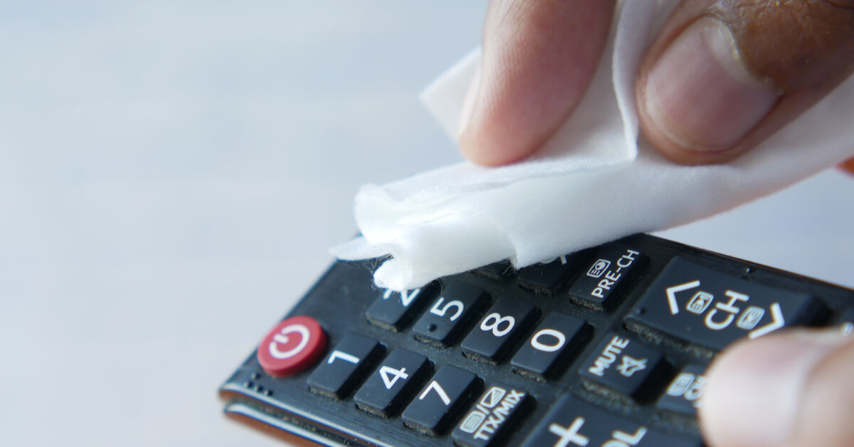 Dirty keyboard and remote with crumbs